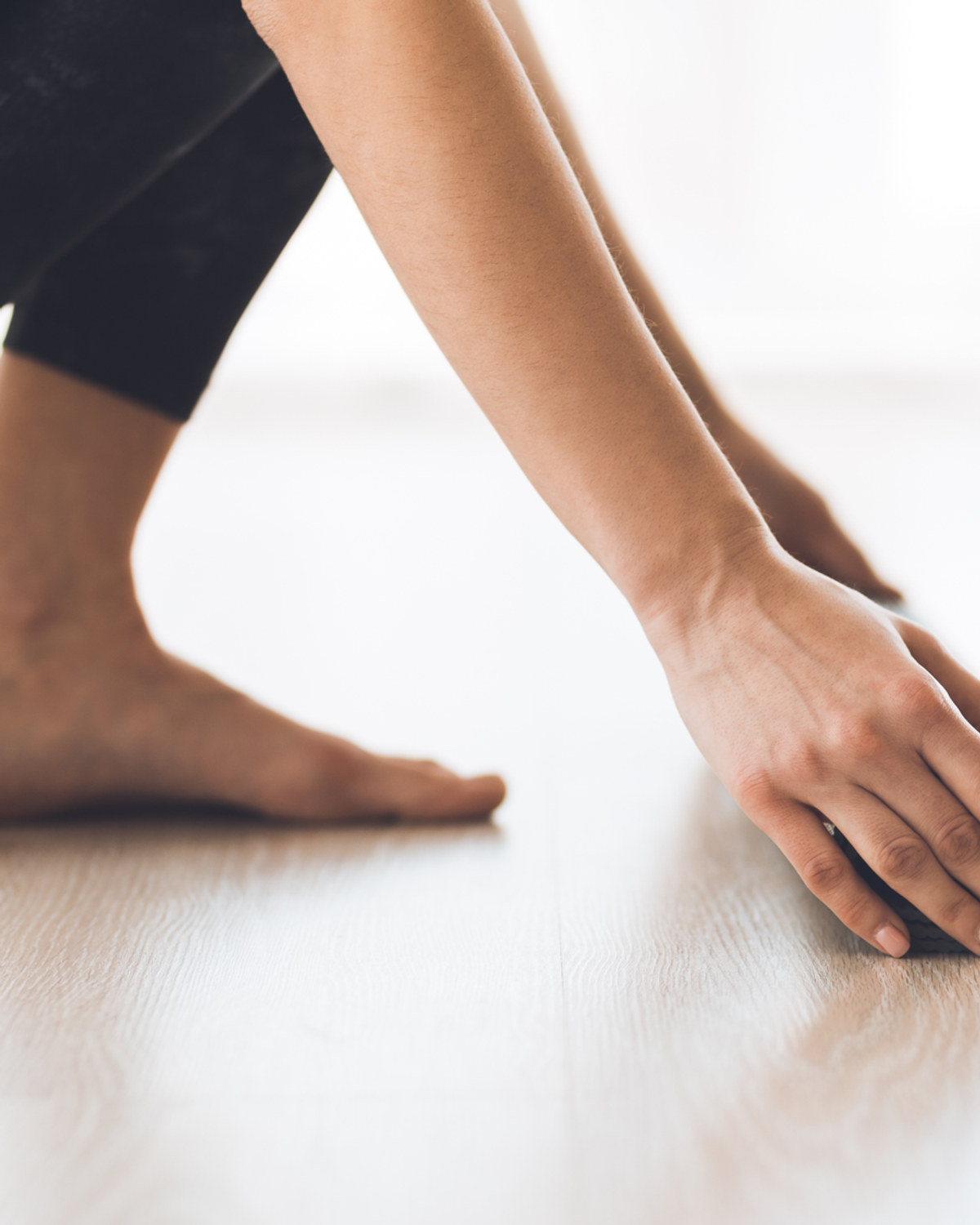Hands and feet in position during a Pilates exercise