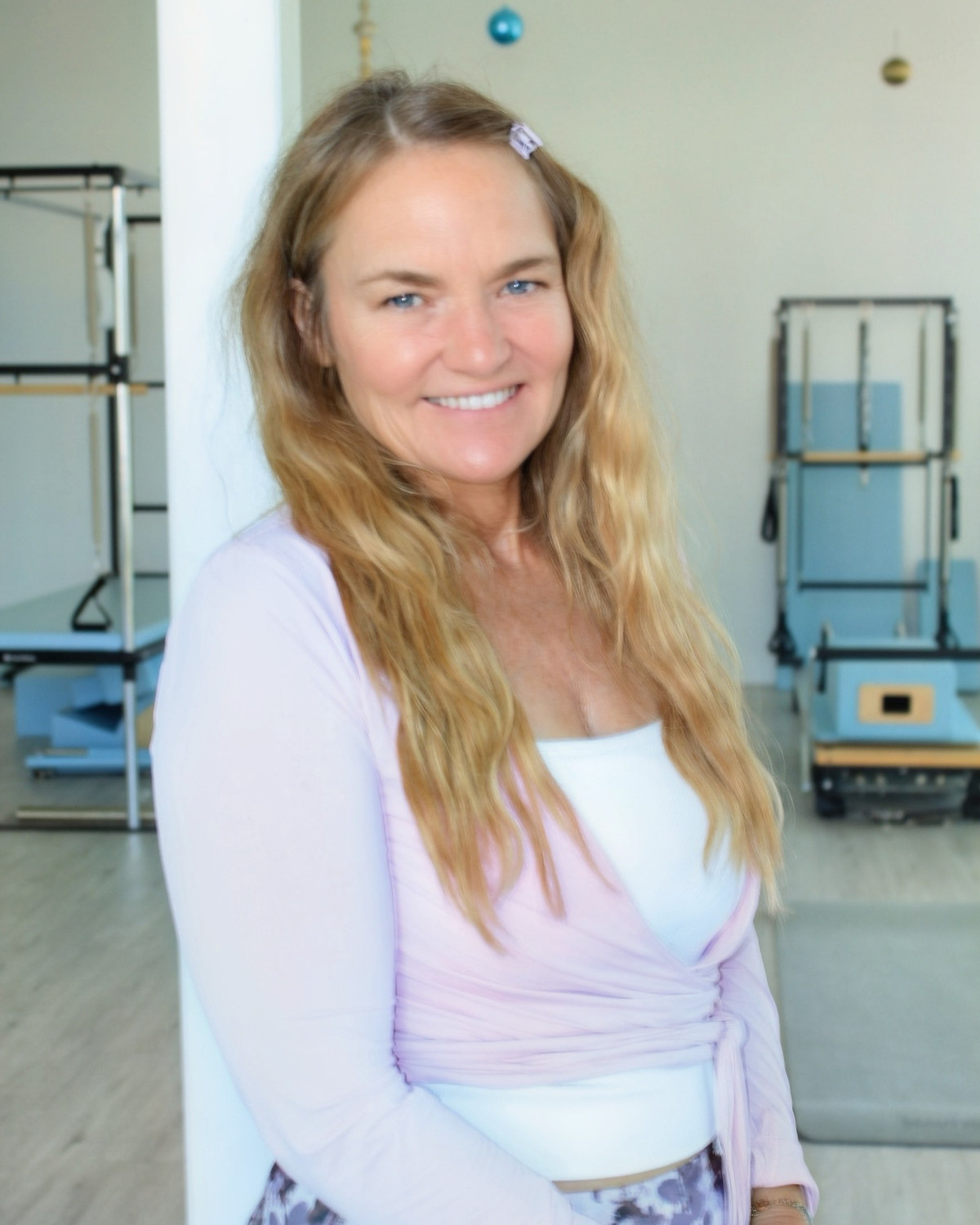 Clients practicing reformer Pilates at Selah in Ocean Springs